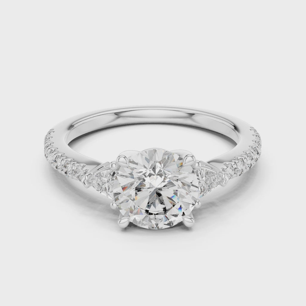 Round Diamond Ring with Trillion Side Stones