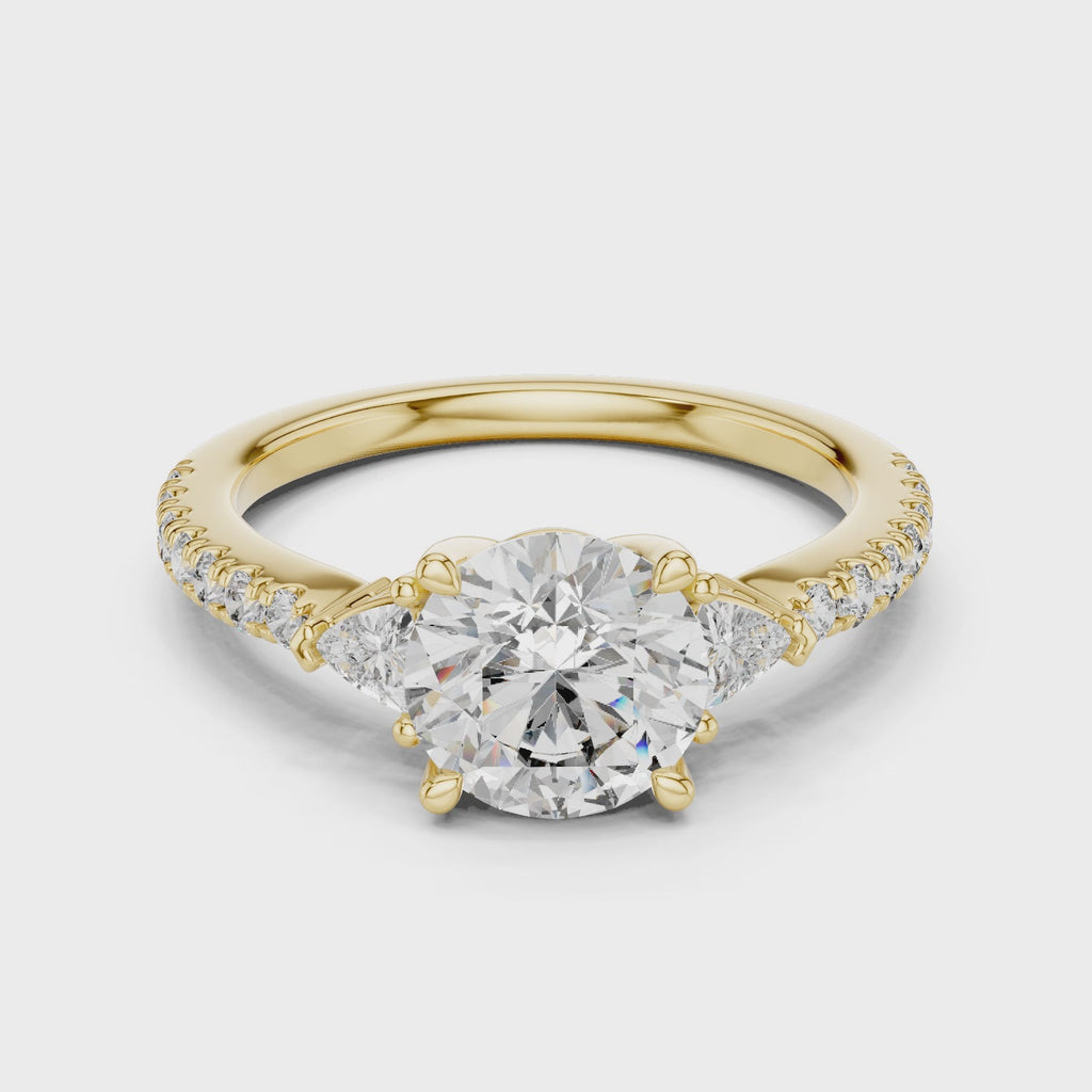 Round Diamond Ring with Trillion Side Stones