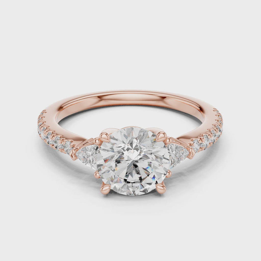 Round Diamond Ring with Trillion Side Stones